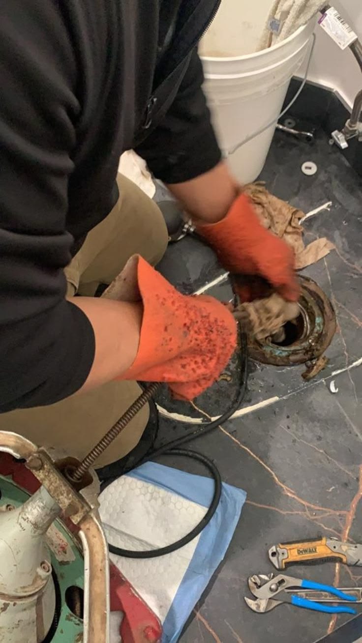 Drain unblocking service under sink